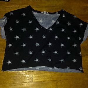 Size small crop top. Black with white stars on it, great shape still.